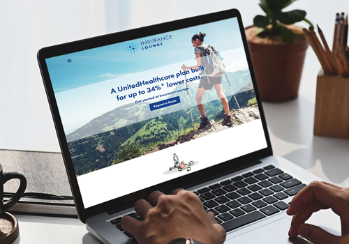 Laptop screen shows Insurance Lounge site about UnitedHealthcare plans over a mountainous hiking photo, conveying a health insurance offer.
