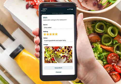 Hand holds a smartphone showing a dish entry form with name 'Chop salad', rating stars, notes, and a thumbnail image. Save Dish visible on screen.
