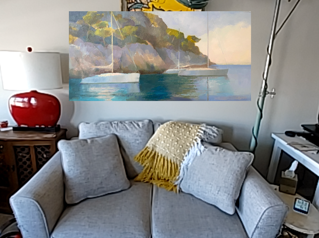 A couch with the AR image of a painting above it.