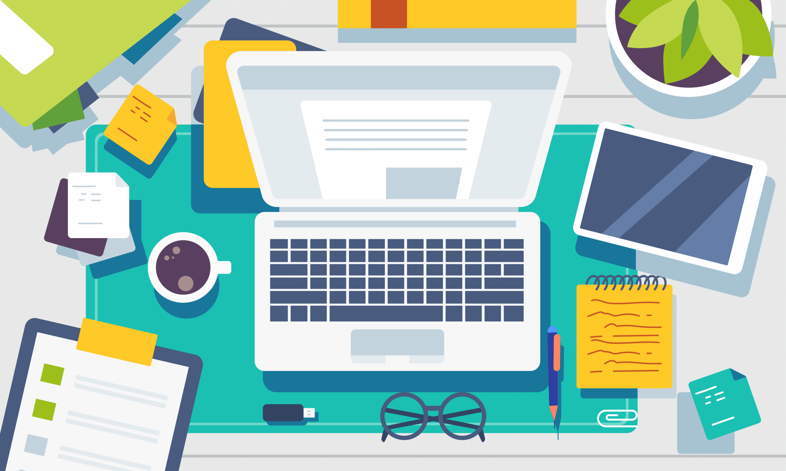 Image of laptop on a crowded desk